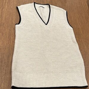 Woman’s Cream V-Neck Sweater Vest cream with black edge.
